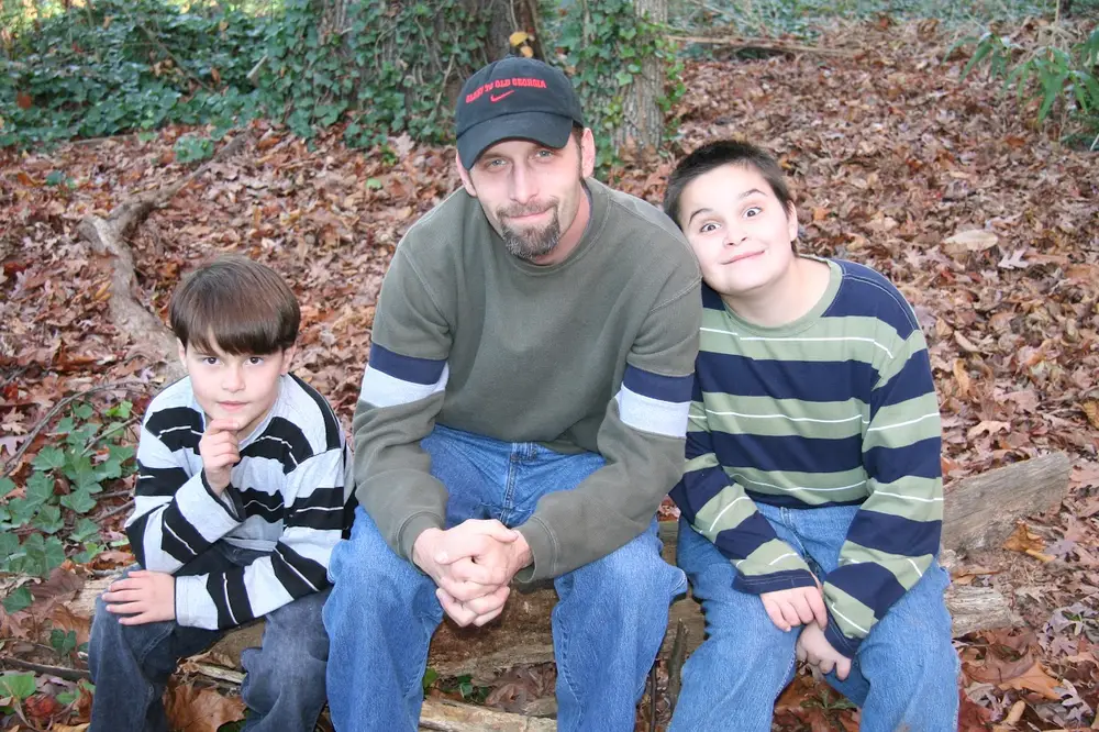 Nolan Plumbing founder Fred Mortus with his two sons, photographed in 2006